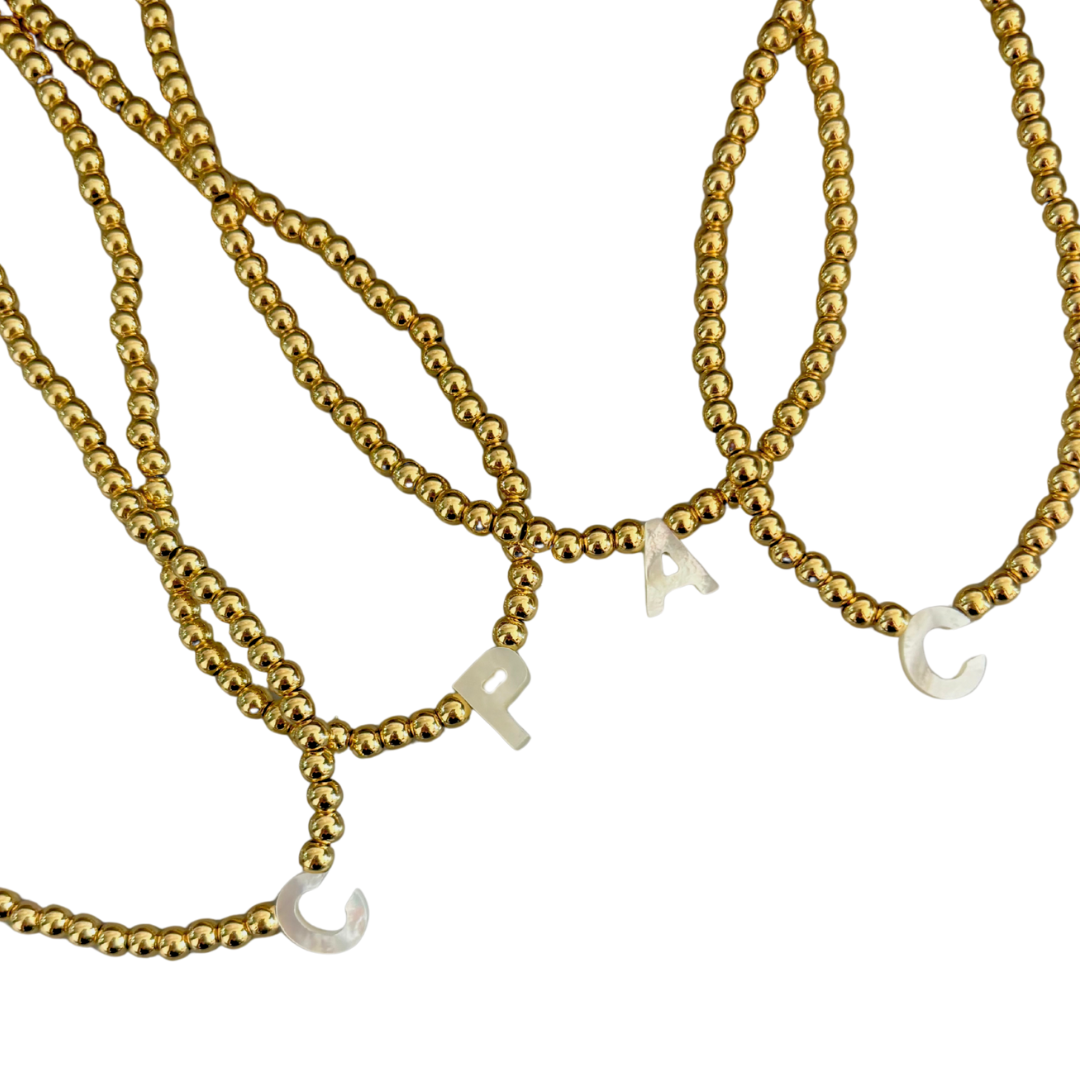 Choker dorado inicial madre perla