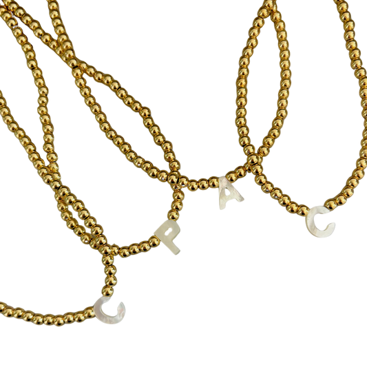 Choker dorado inicial madre perla