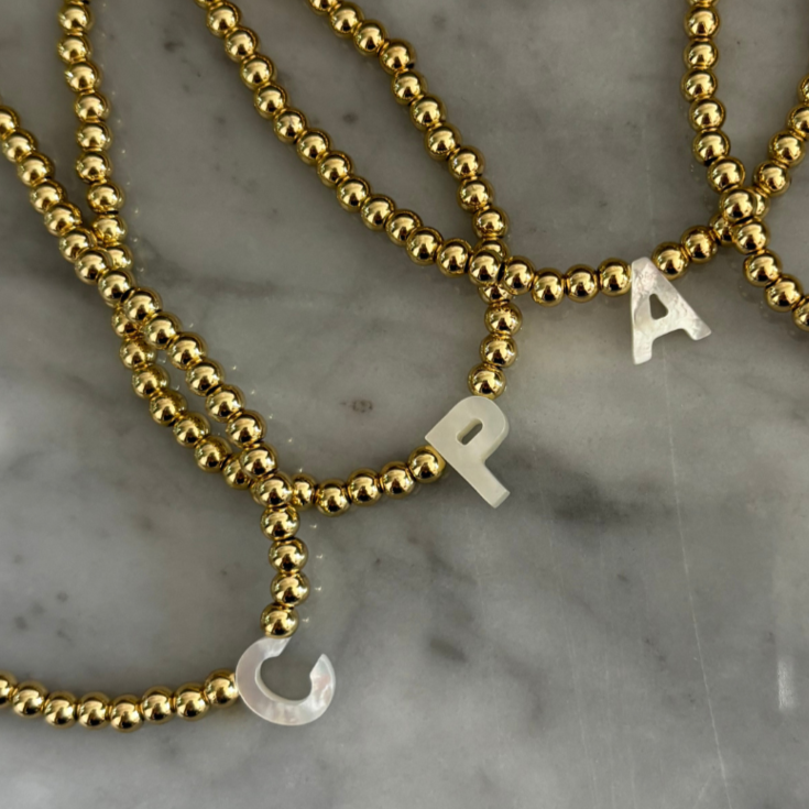 Choker dorado inicial madre perla